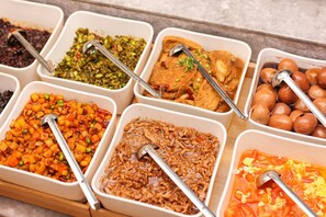 A buffet with various dishes including a vegetable stir-fry, a meat dish, and a tomato-based soup. - JI Hotel Shanghai The Bund Jiujiang Road (Shanghai)