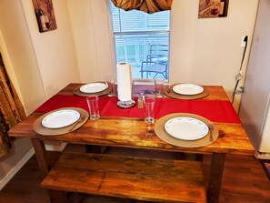 Enjoy your home cooked meal on our farm style wood table. 