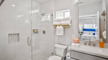Combined shower/tub, hair dryer, towels, soap