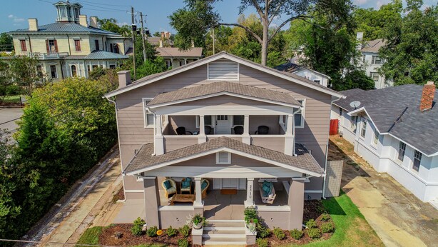 A two-story house with a front porch, a covered entryway, and a number '2310' on the front. - Oak - Walk to the Stadium!  Backyard with firepit & grill (Tuscaloosa)