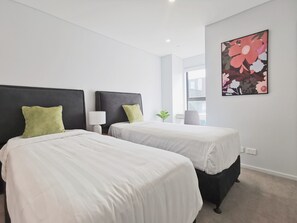 2 bedrooms, desk, blackout drapes, iron/ironing board