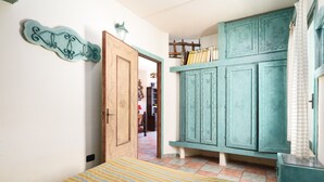 A bedroom with a bed, a wardrobe, and a door leading to another room. - Holiday Home "Sa Burrida" with Garden, Covered Terrace & Fireplace (posada)
