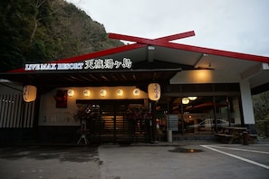 The entrance of Live Max Resort with a red roof and traditional Japanese signage. - Livemax Resort Amagi Yugashima (Izu)