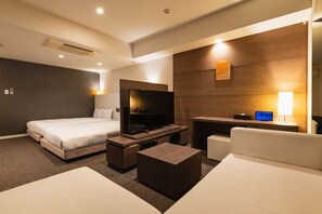 A modern hotel room with a large bed, a TV, a desk, and a sofa. - Hotel The Hakata Terrace Fukuoka (Fukuoka)