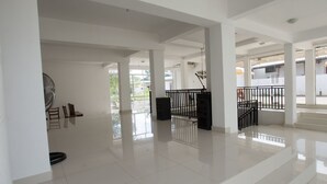 A spacious, well-lit interior with high ceilings and large windows. - Empyrean Hotel (Seeduwa - Katunayake)