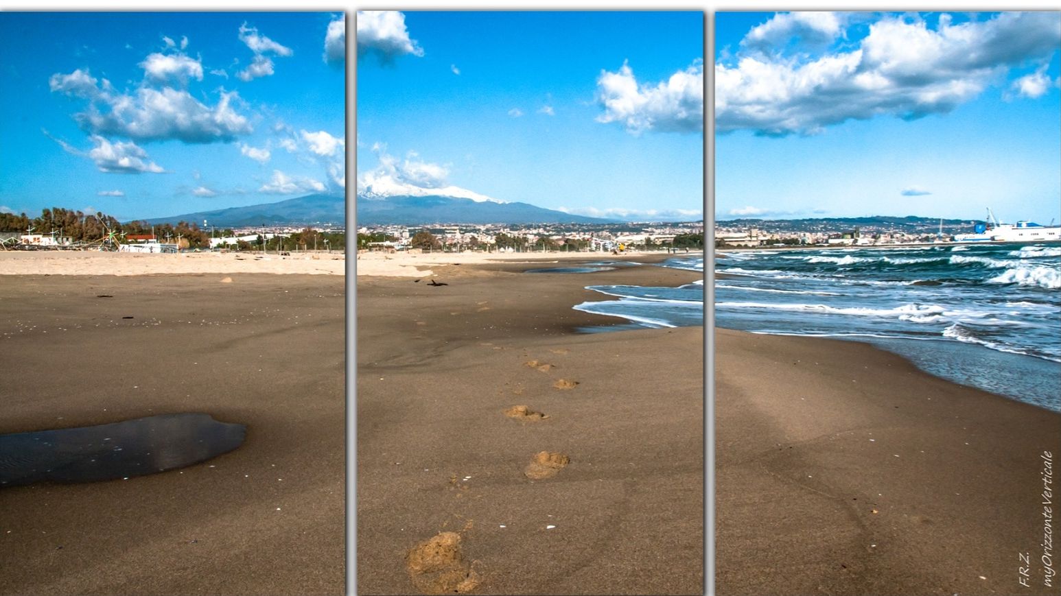 Une plage où l ’on voit des empreintes de pas menant à l’eau, une montagne en arrière-plan et un ciel dégagé.