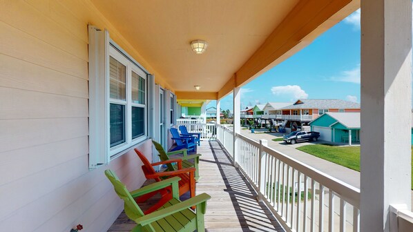 Relax on the covered porch with Adirondack chairs and enjoy the view.