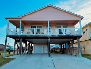 Two-story home with a balcony and garage.