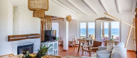 Panoramic Villa | Living area | 25-inch flat-screen TV with cable channels