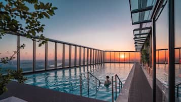 Outdoor pool, open 7:00 AM to 10:00 PM, pool umbrellas, pool loungers
