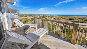 A wooden deck with two white lounge chairs overlooking a beach. - Oceanfront Dog Friendly Home in Avon w/ Elevator, Hot Tub, Game Room, Wet Bar (Avon)