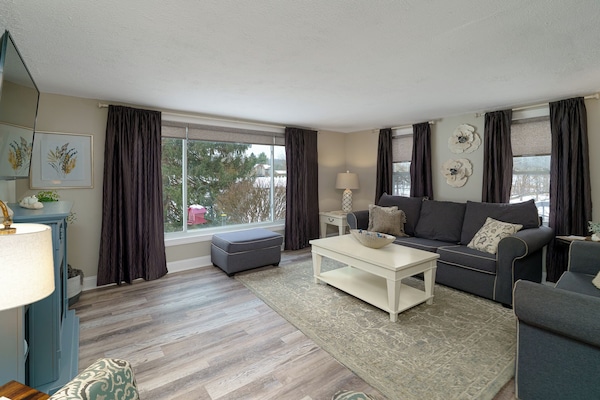 Living room perfect for bird watching out of the large picture window.