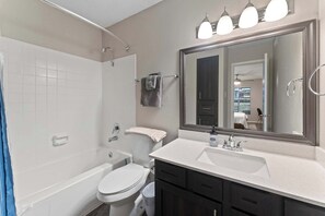 Shower, hair dryer, towels, shampoo