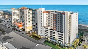 A high-rise hotel with multiple floors, balconies, and a view of the ocean. - Penthouse, 3-bedroom, 3-bathrooms, updated flooring and countertops  | South Shore Villas - PH05 (North Myrtle Beach)