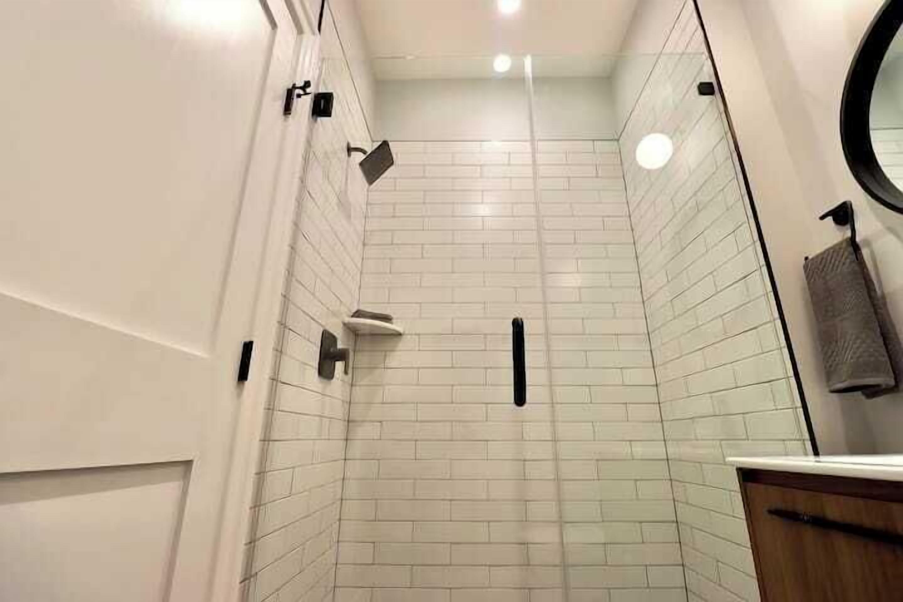 Shower, hair dryer, towels, shampoo