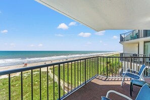 A balcony with a view of the beach and ocean. - 3-bedroom oceanfront condo with private balcony | Crescent Sands - 5-G (North Myrtle Beach)