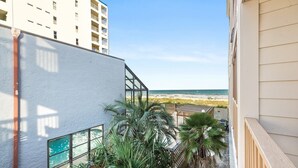 A balcony with a view of the beach and ocean. - Ocean View Condo in Crescent Beach | Crescent Beach Villas - 108 (North Myrtle Beach)