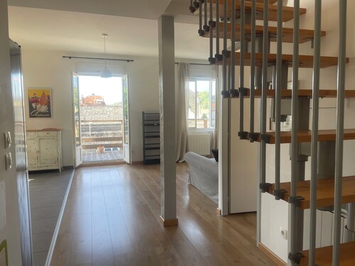 A quiet, bright apartment 400 meters from downtown, with private parking.