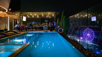 Outdoor pool, open 11:00 AM to 8:00 PM, pool loungers