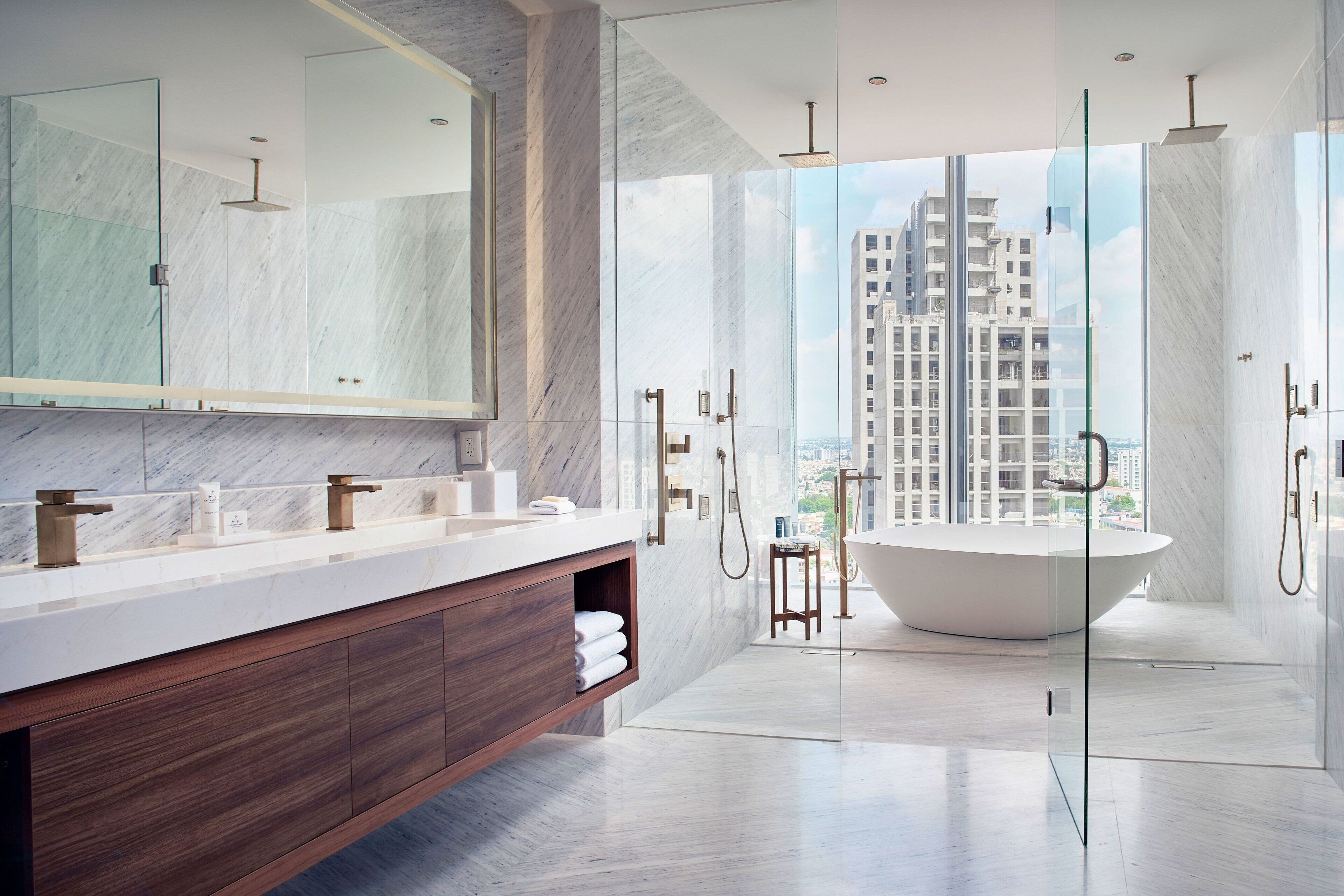 junior suite, 1 king bed | bathroom | rainfall showerhead, hair dryer, slippers, towels