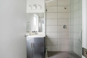 Combined shower/tub, hair dryer, towels, soap