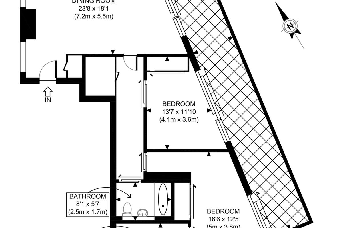 A floor plan of a hotel with a balcony, kitchen, reception/dining room, two bedrooms, a bathroom, and an ensuite.