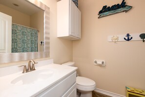 Combined shower/bathtub, towels, soap, toilet paper