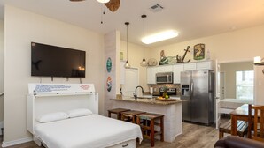 A compact living space with a bed, kitchenette, and dining area. - 4br/3Ba Oceanview from balcony!  Sleeps 12 w/ hot tub! (Corpus Christi)