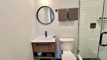 Shower, hair dryer, towels, shampoo
