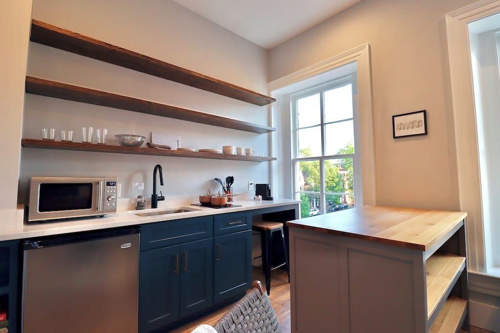Fridge, microwave, coffee/tea maker, cookware/dishes/utensils
