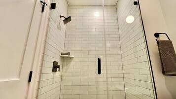 Shower, hair dryer, towels, shampoo
