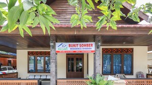 A residential property named Bukit Somber with a wooden facade, a signboard, and a gated entrance. - OYO 3789 Bukit Somber Residence Syariah (Balikpapan)