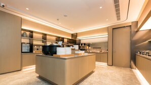 A modern kitchen with a central island, built-in appliances, and a sleek design.