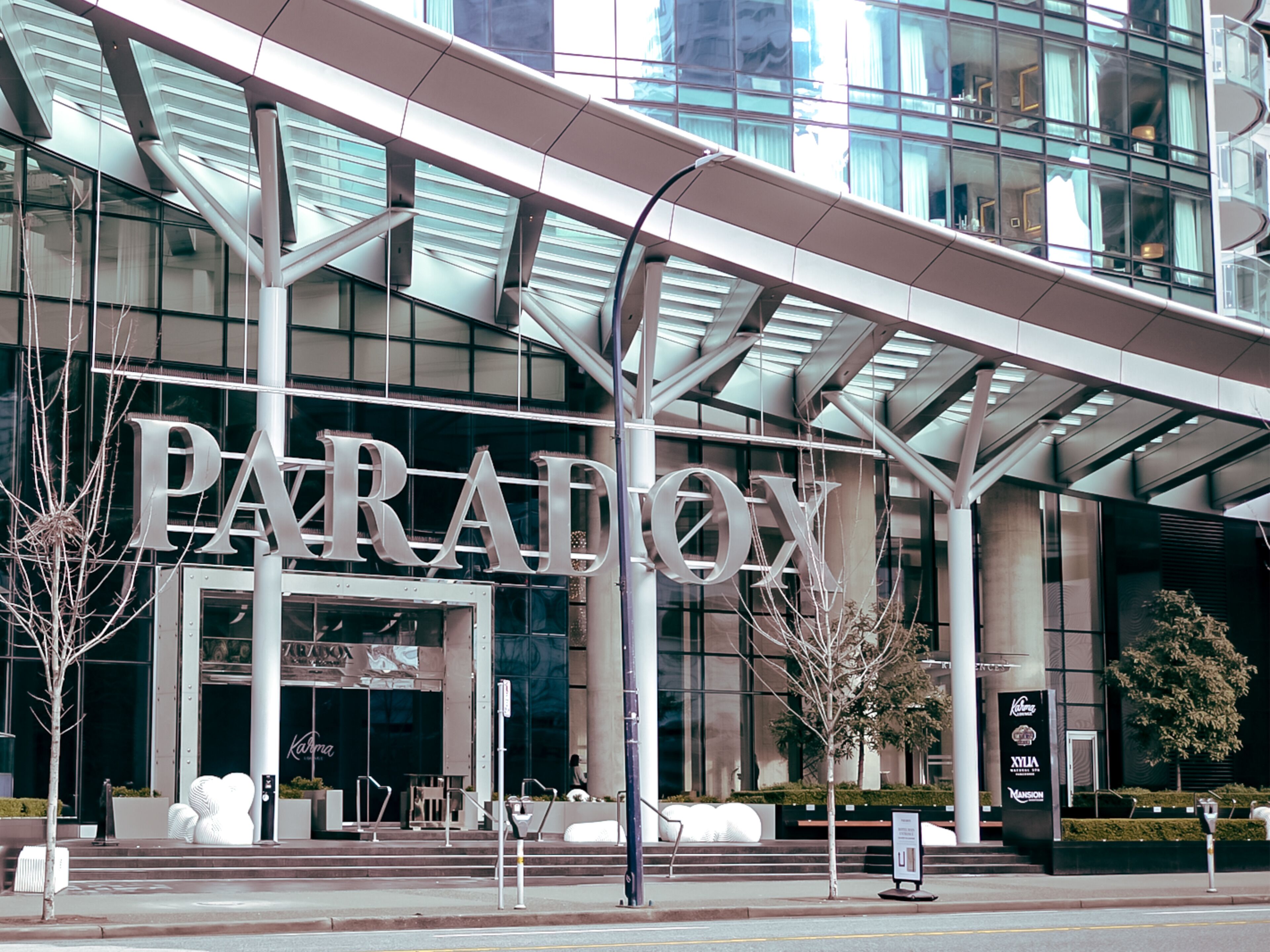 A modern building with a large sign reading "PARADOX".