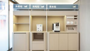 A hotel room with a minibar, a coffee machine, and a tea station. - Hanting Hotel Shanghai The Bund Jiangxi Middle Roa (Shanghai)