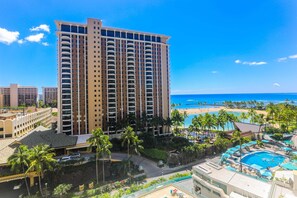 A high-rise hotel with a pool area and beach view. - Ilikai Hotel - Spacious Lanai with Views of the Lagoon and Waikiki Beach! (Honolulu)