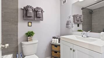 Bathtub, hair dryer, towels