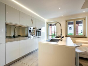 Oven, dishwasher, toaster, dining tables