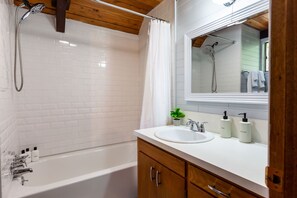 Combined shower/tub, hair dryer, towels, soap