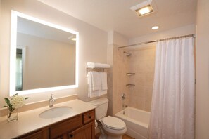 Bathtub, hair dryer, towels, soap