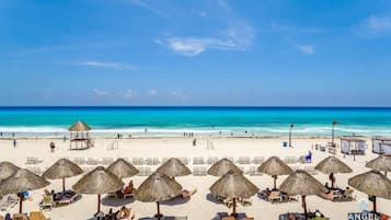 On the beach, sun-loungers, beach towels