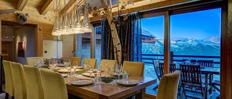 Enjoy meals in this cozy dining area with a view of the surrounding mountains.