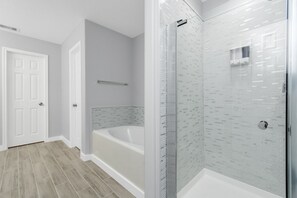 Combined shower/bathtub, hair dryer, towels, soap