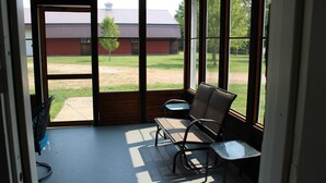 A room with a large window, two chairs, and a table. -  Charming house near Maramec Spring Park, Steelville/St. James (Steelville)