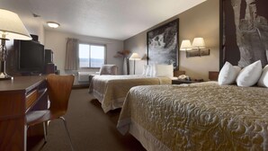A hotel room with two beds, a desk, a chair, a television, and a large abstract painting on the wall. - Super 8 by Wyndham Sioux Falls/41st Street (Sioux Falls)