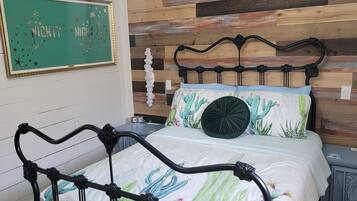 1 bedroom, desk, iron/ironing board, travel crib