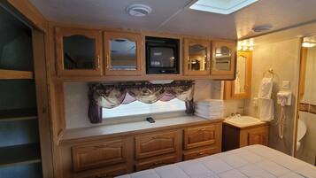 1 bedroom, desk, travel crib, bed sheets