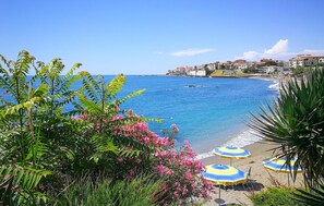 A coastal view with a beach, clear blue sea, and a town in the background. - Awesome home in Diamante with WiFi (Diamante)