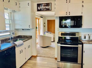 Enjoy cooking in this well-equipped kitchen with a dishwasher, sink, and oven.