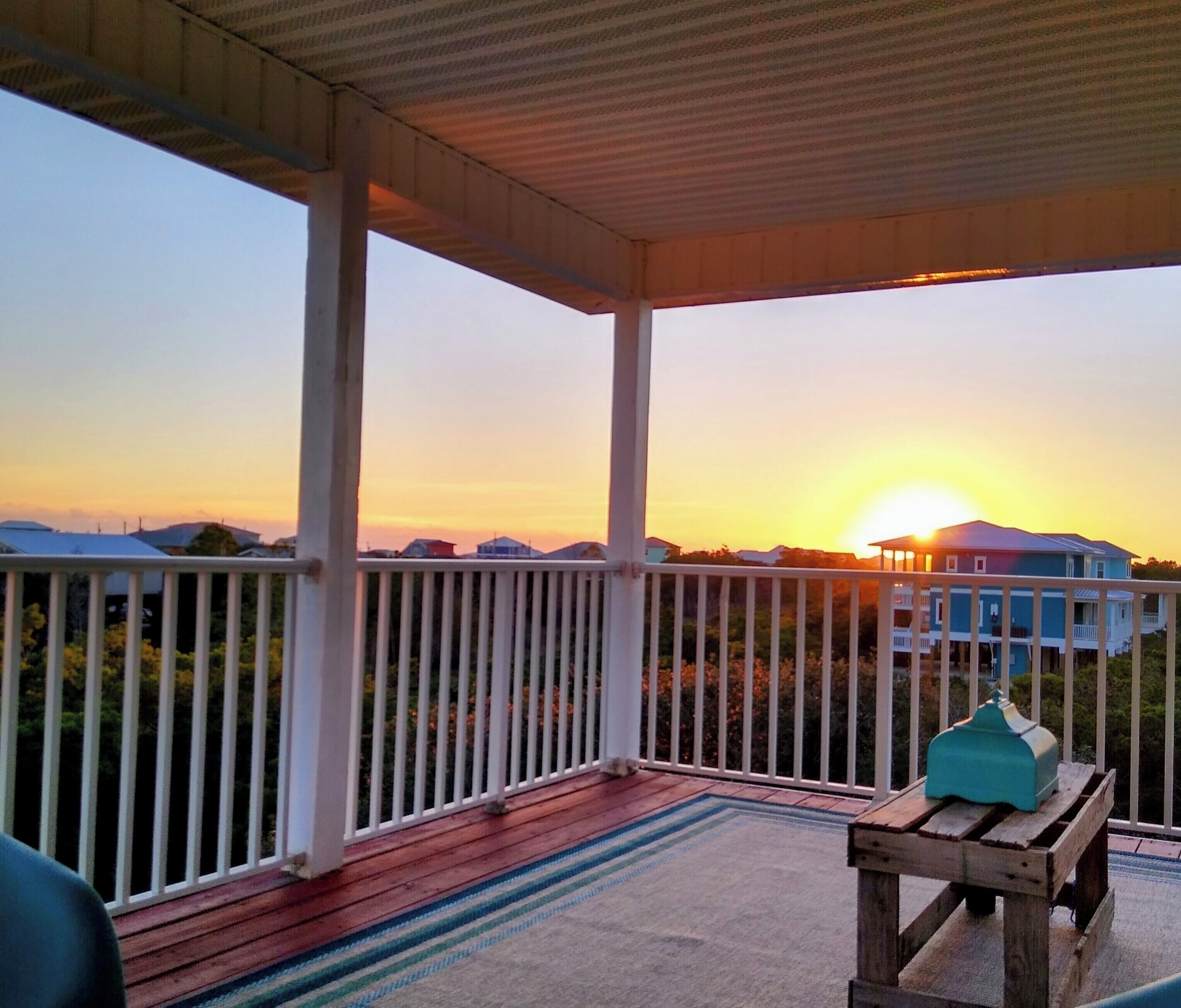 SUNSET VIEW FROM BALCONY WITH REMOTE CONTROL SCREENS UP! LOCATED ON 2nd FLOOR.
